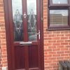 Rosewood woodgrain PVCu front door with Addison Glass 